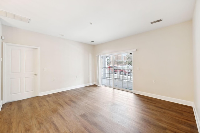 spare room featuring hardwood / wood-style flooring