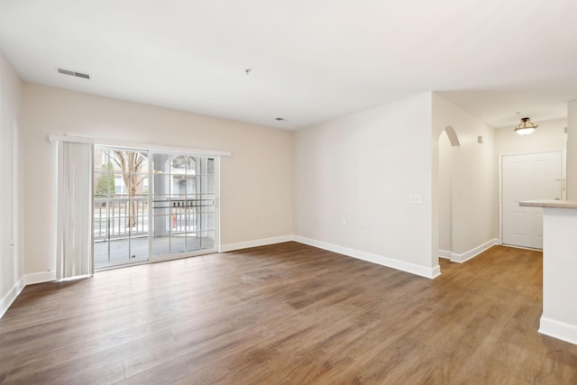 spare room featuring hardwood / wood-style flooring