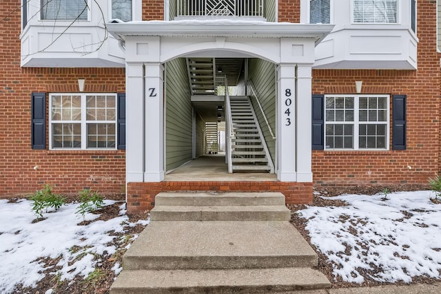 view of snow covered property entrance