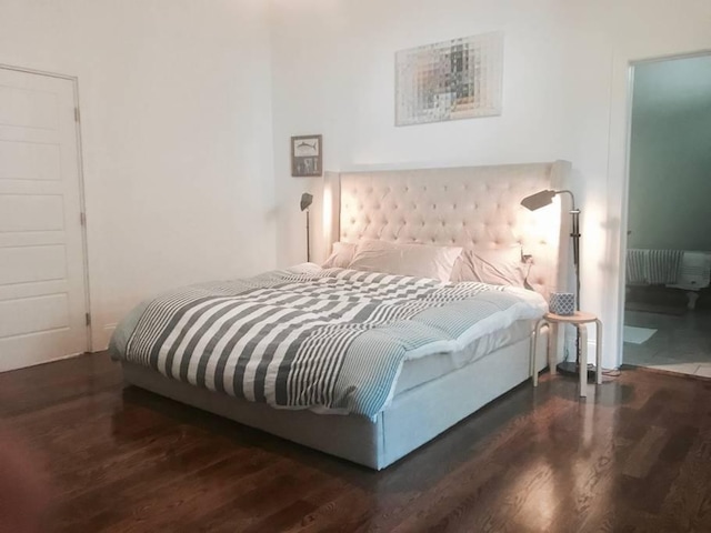 bedroom featuring dark hardwood / wood-style flooring