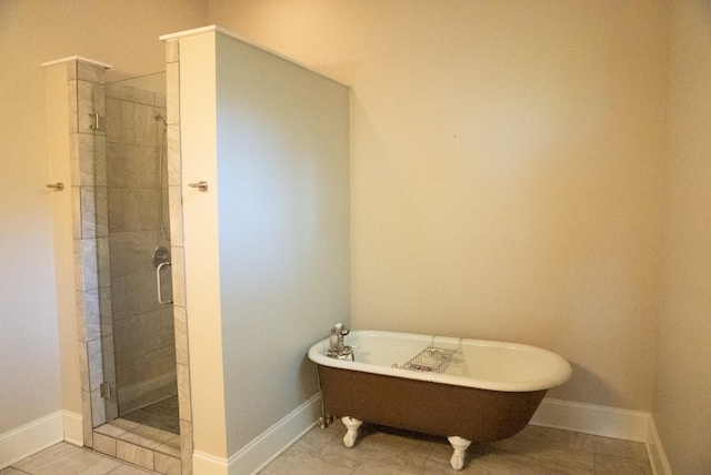 bathroom with tile patterned floors and independent shower and bath