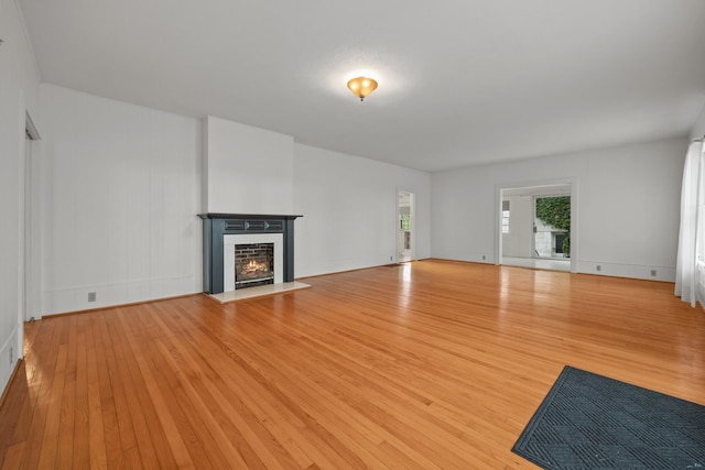 unfurnished living room featuring light hardwood / wood-style floors