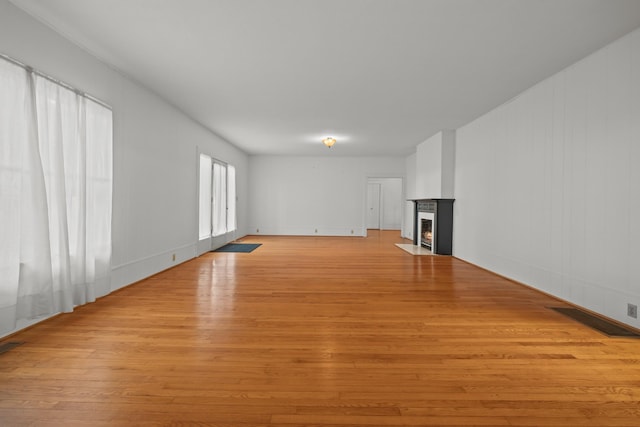 unfurnished living room with light hardwood / wood-style floors