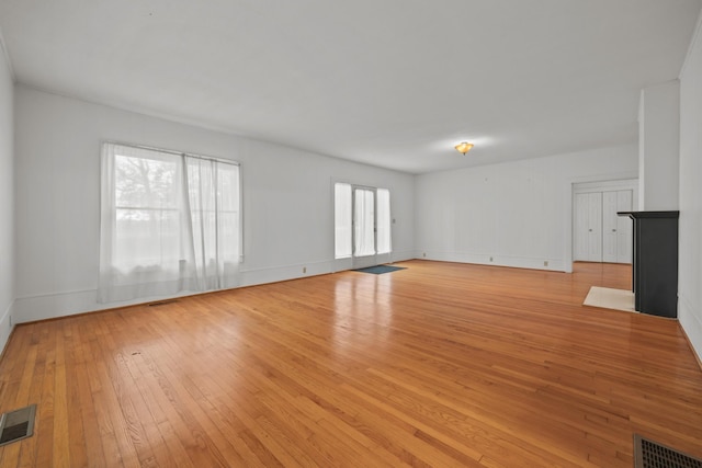 unfurnished living room featuring light hardwood / wood-style flooring