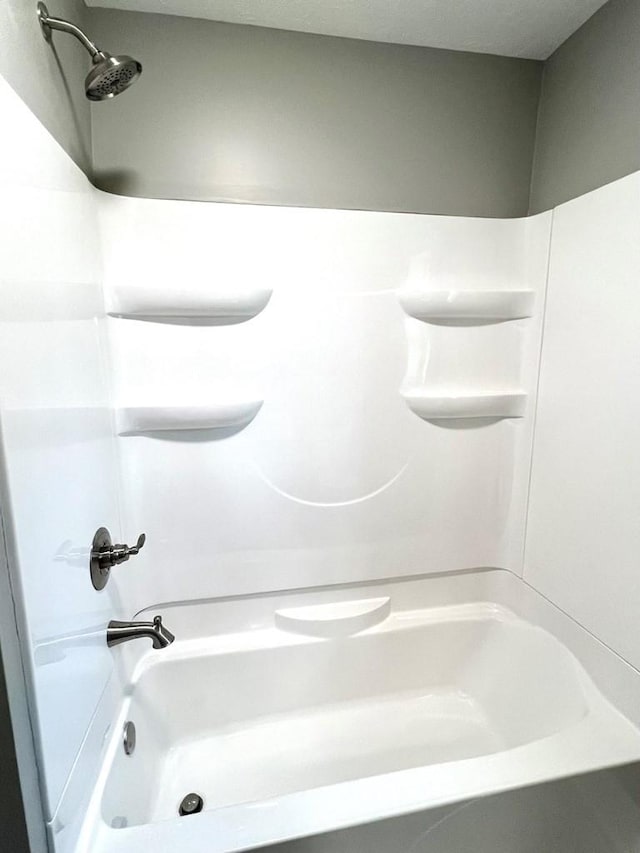 bathroom with shower / bath combination