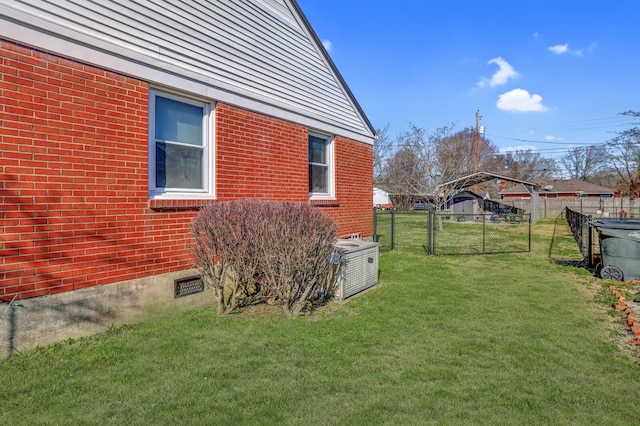 view of side of home with a lawn