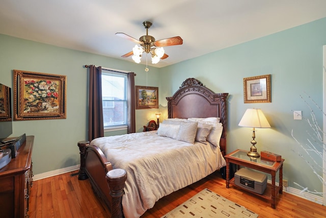 bedroom with ceiling fan and light hardwood / wood-style flooring