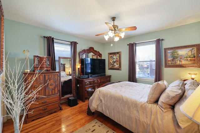 bedroom featuring ceiling fan and light hardwood / wood-style floors