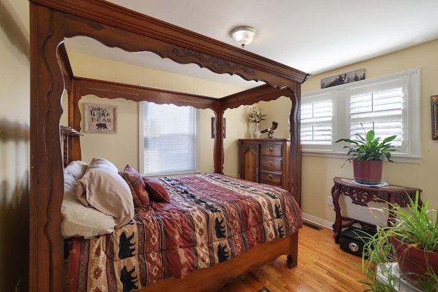 bedroom with light hardwood / wood-style flooring