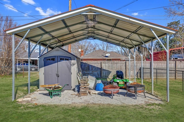 exterior space featuring a fire pit and a yard