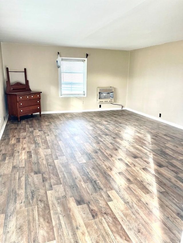 living room featuring dark hardwood / wood-style flooring and heating unit