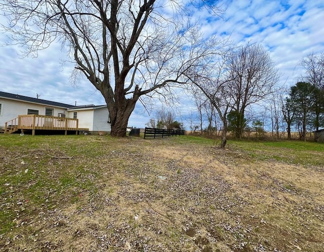 view of yard with a wooden deck