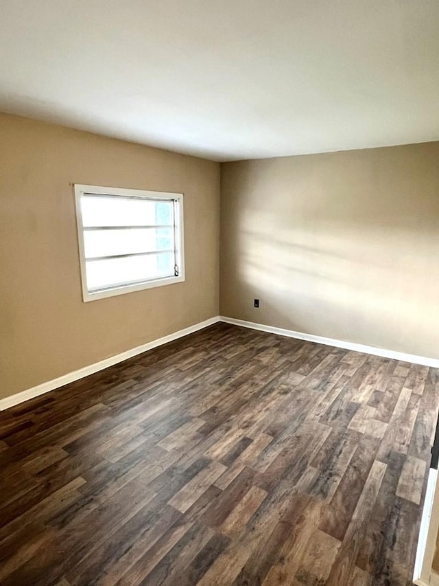 empty room featuring dark hardwood / wood-style floors