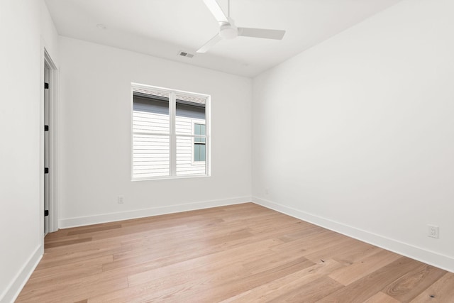 spare room featuring light hardwood / wood-style flooring and ceiling fan