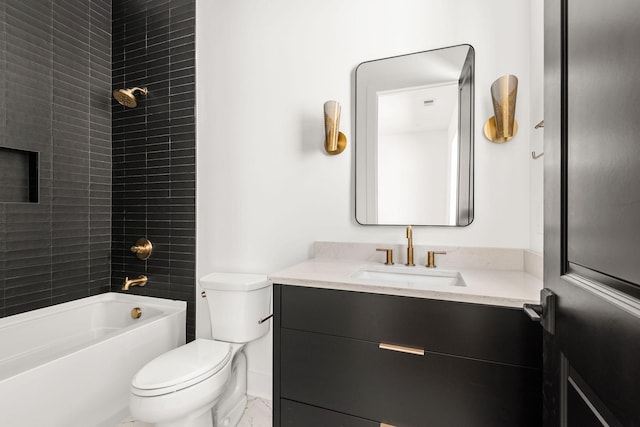 full bathroom featuring vanity, tiled shower / bath combo, and toilet