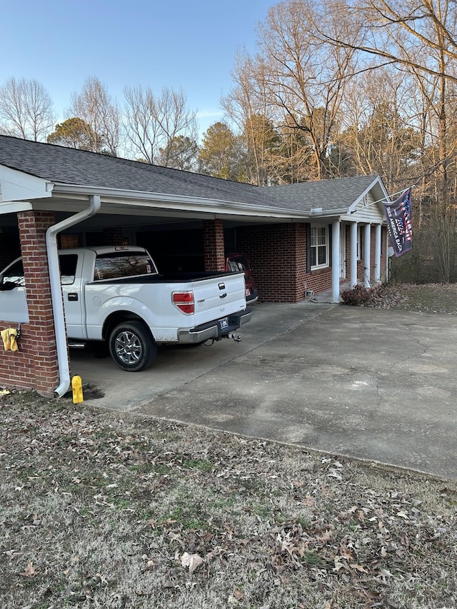 view of side of home featuring a carport