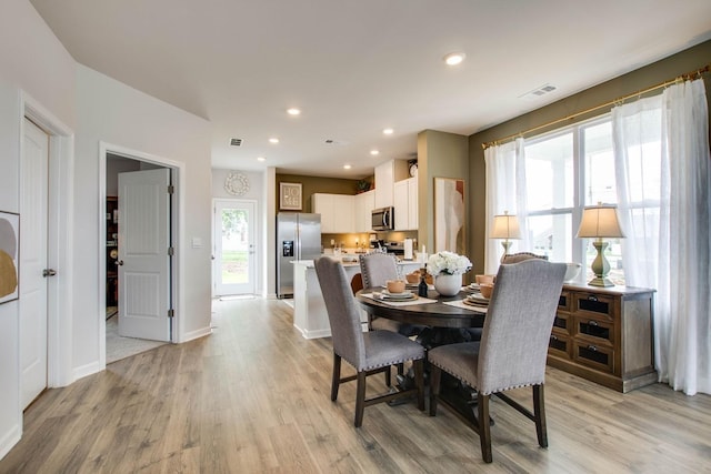 dining room with light hardwood / wood-style floors