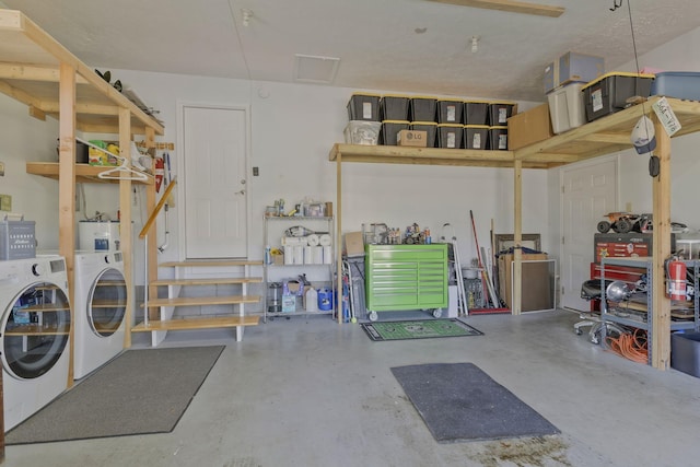 garage featuring washer and clothes dryer