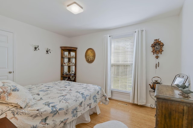 bedroom with light hardwood / wood-style floors