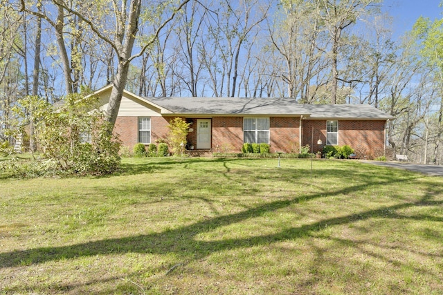 ranch-style house with a front lawn