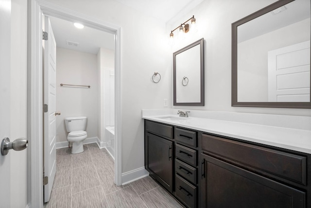 full bathroom with vanity, bathtub / shower combination, and toilet