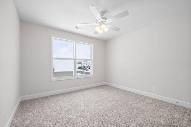 unfurnished room with ceiling fan and carpet floors