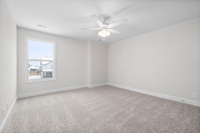 unfurnished room with carpet floors and ceiling fan