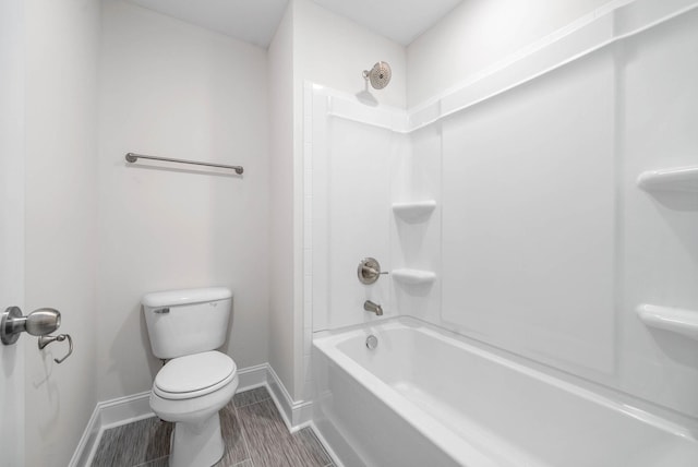 bathroom with toilet and shower / bath combination