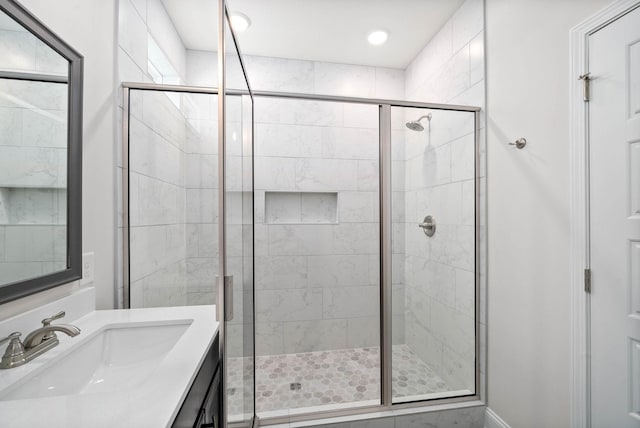 bathroom with vanity and an enclosed shower