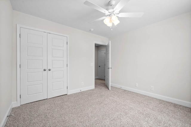 unfurnished bedroom with a closet, ceiling fan, and carpet