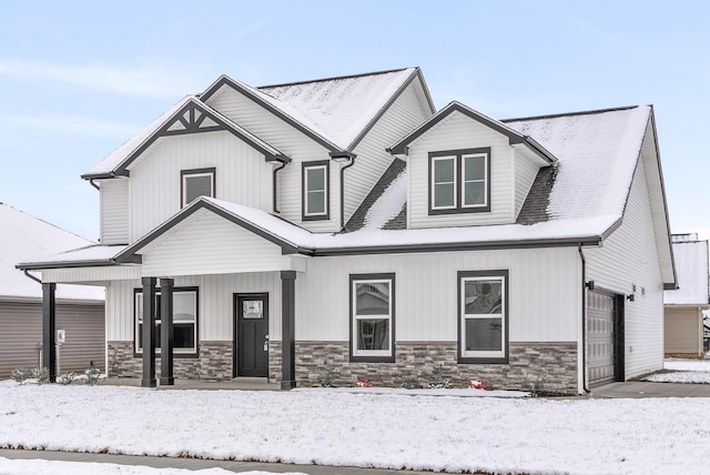 view of front of home with covered porch and a garage