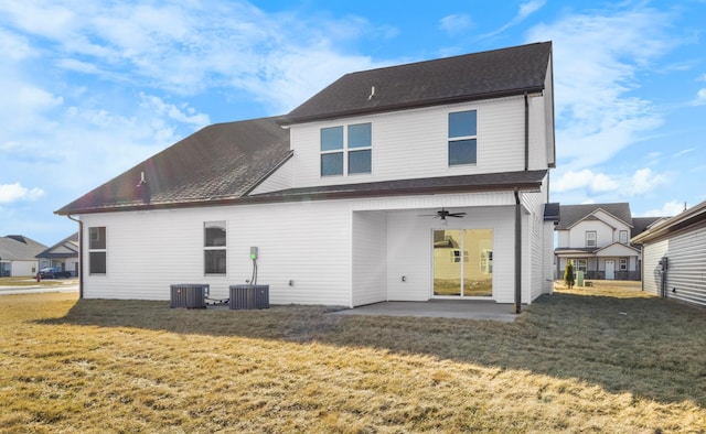 rear view of house with ceiling fan, a yard, central air condition unit, and a patio area