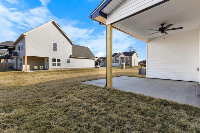 view of yard featuring a patio and ceiling fan