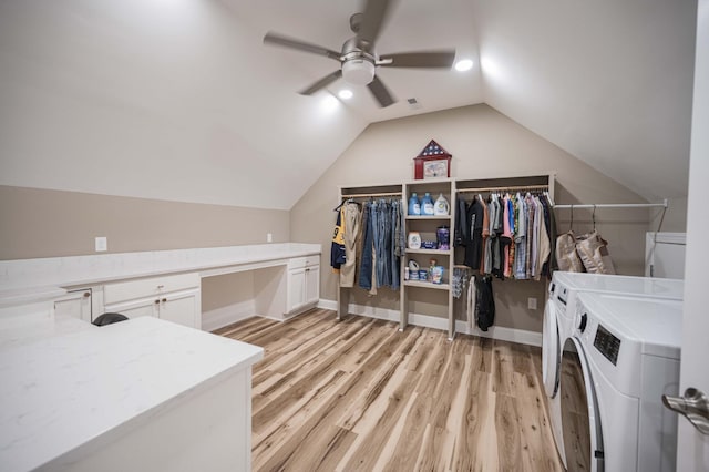 laundry area with washer and dryer, ceiling fan, and light hardwood / wood-style floors