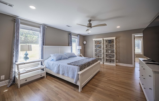 bedroom featuring wood-type flooring and ceiling fan