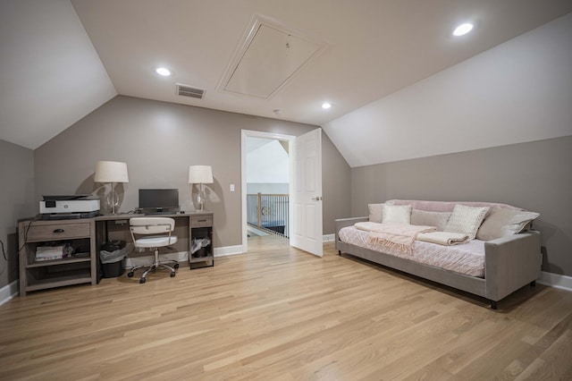 office space featuring light hardwood / wood-style floors and vaulted ceiling