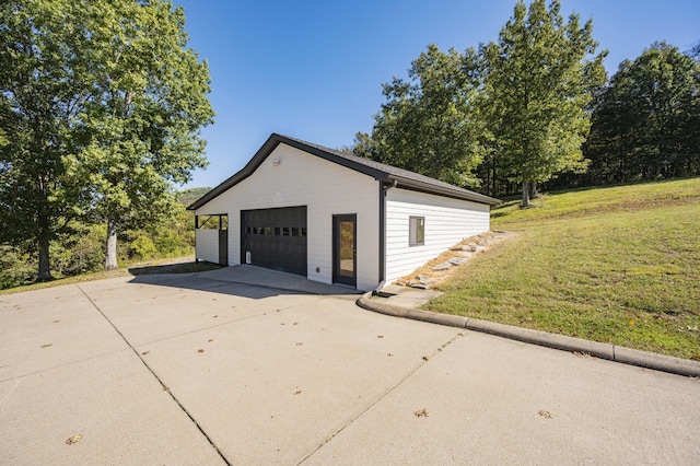 garage featuring a yard