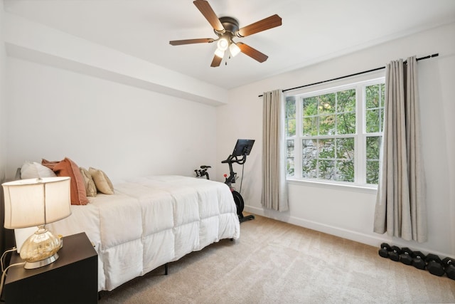 carpeted bedroom with ceiling fan