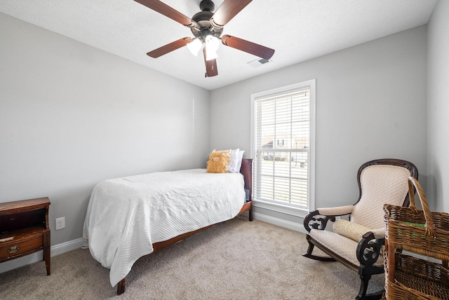 bedroom with ceiling fan and light colored carpet