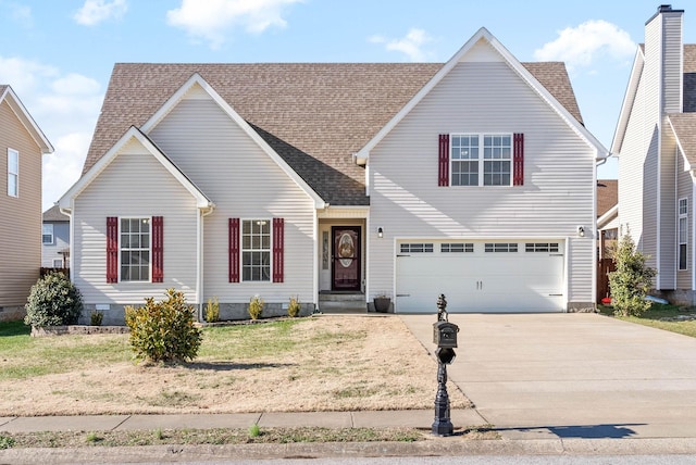 view of front facade with a front yard and a garage