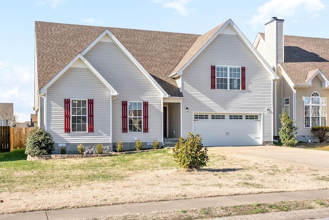 view of front of home featuring a garage and a front lawn