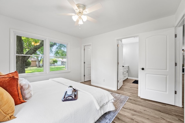 bedroom featuring light wood-style floors, ceiling fan, and baseboards