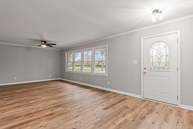 foyer with light wood-type flooring, crown molding, baseboards, and ceiling fan