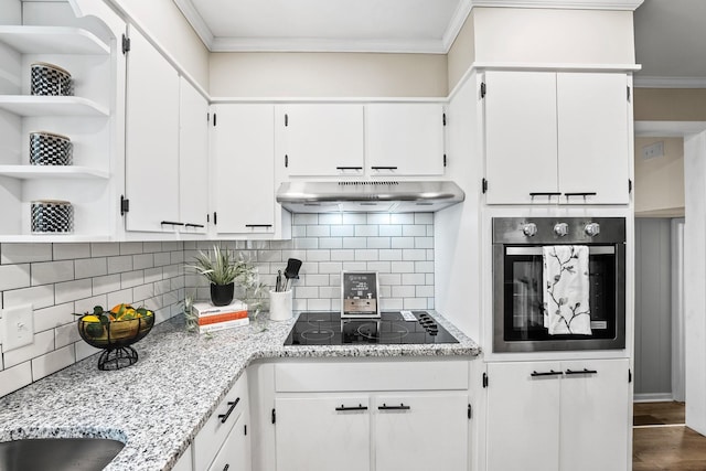 kitchen with black electric cooktop, under cabinet range hood, stainless steel oven, white cabinets, and open shelves