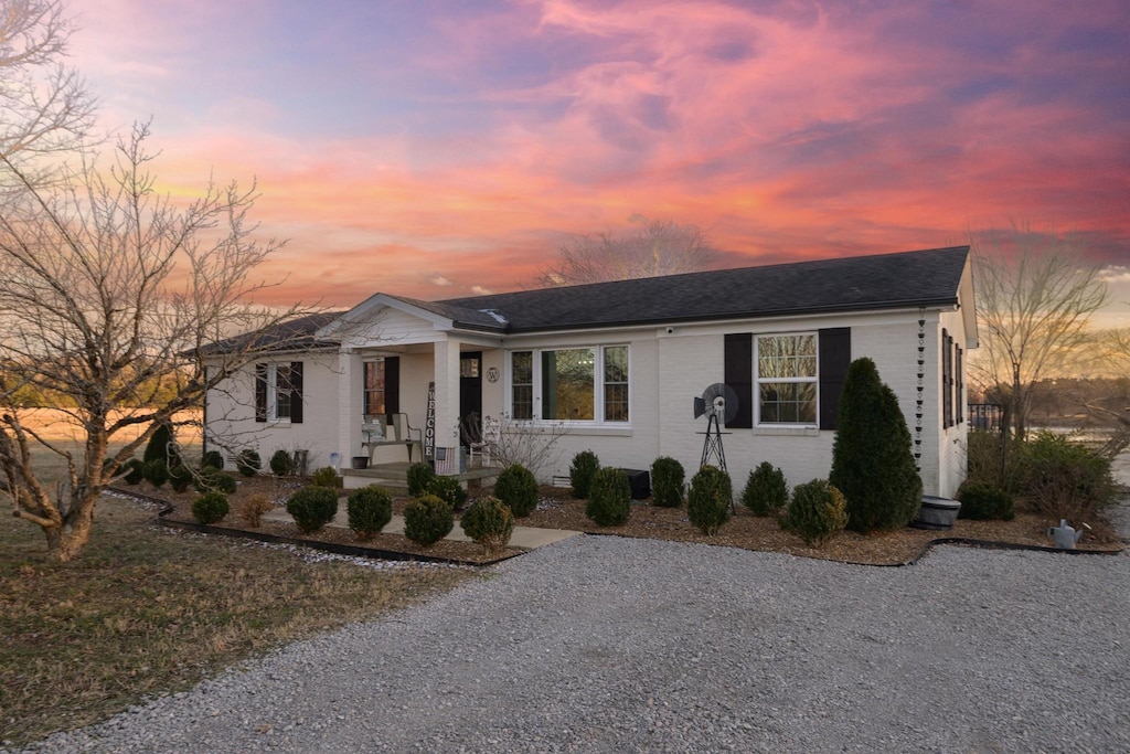 ranch-style home featuring covered porch