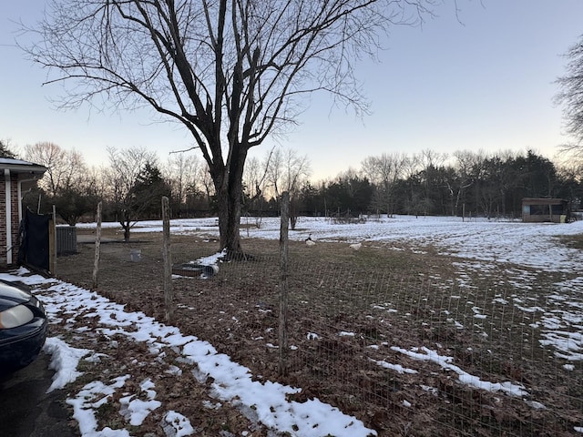 view of yard layered in snow