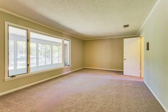 unfurnished room with crown molding, carpet, and a textured ceiling