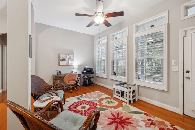 office space featuring ceiling fan and light hardwood / wood-style floors