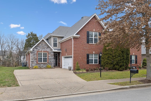 view of front facade with a front yard and a garage