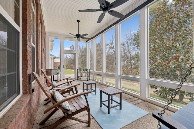 sunroom / solarium featuring ceiling fan